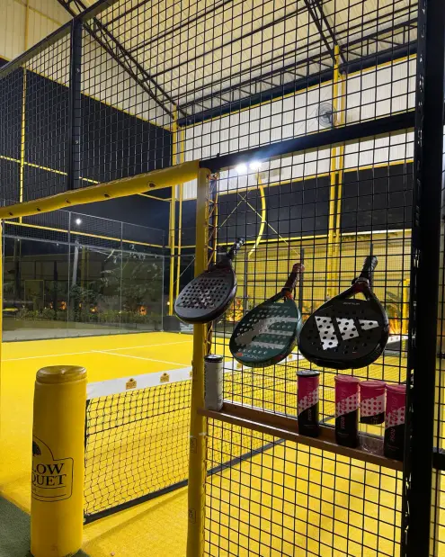 Rackets hanging on the court fence